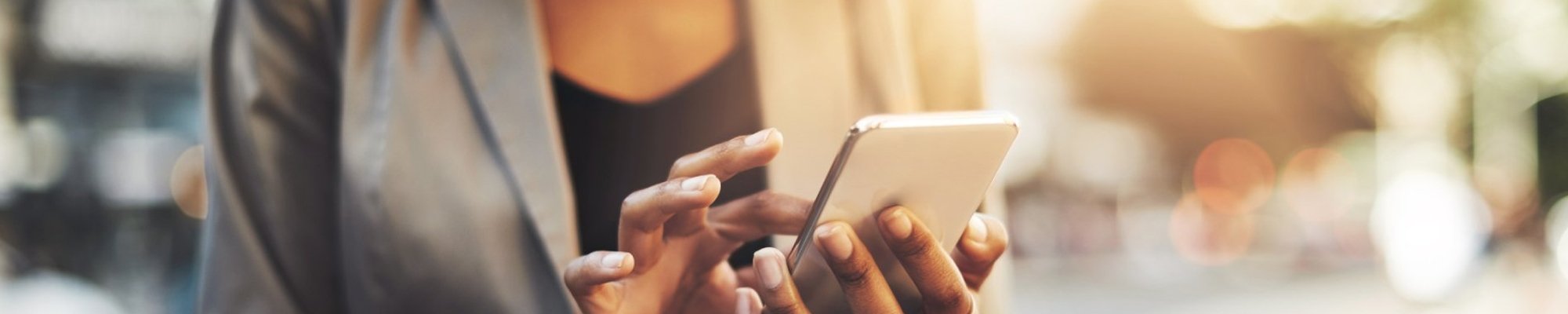 person using phone from The Barton Co. Carpets in San Antonio, TX