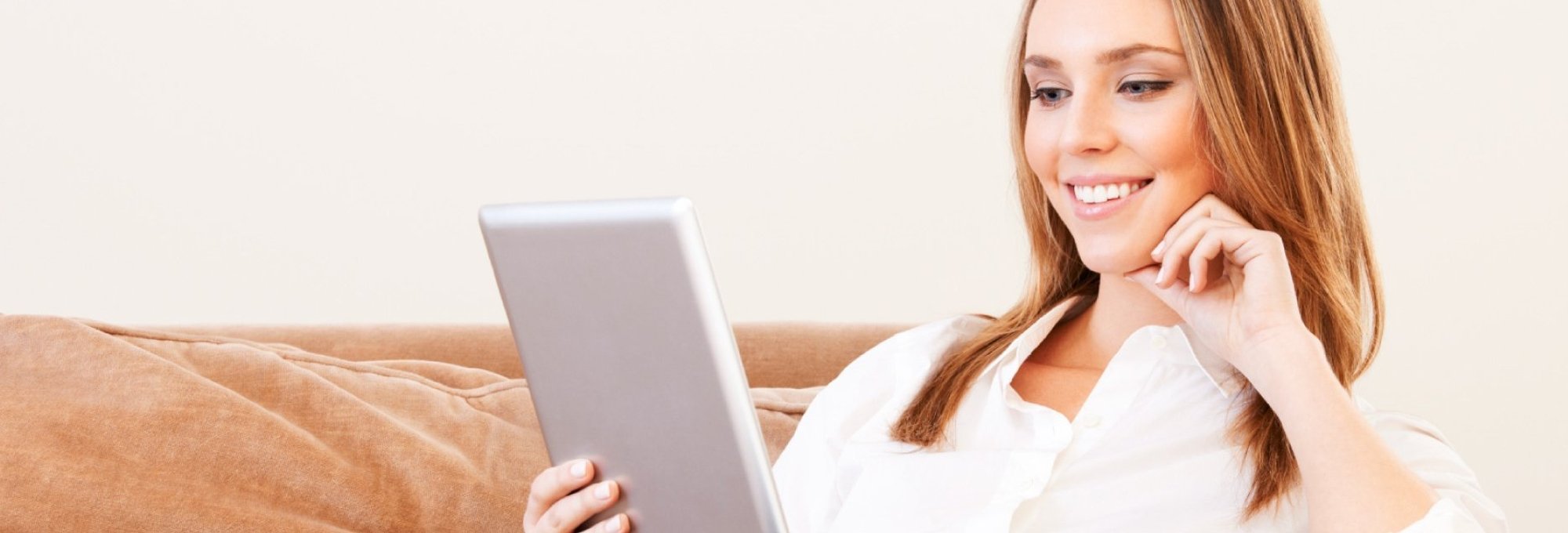 person using tablet from The Barton Co. Carpets in San Antonio, TX