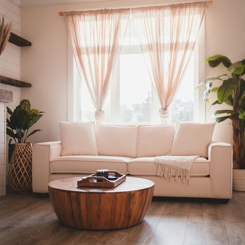 cozy-living-room-with-white-sofa-and-wooden-coffee-table